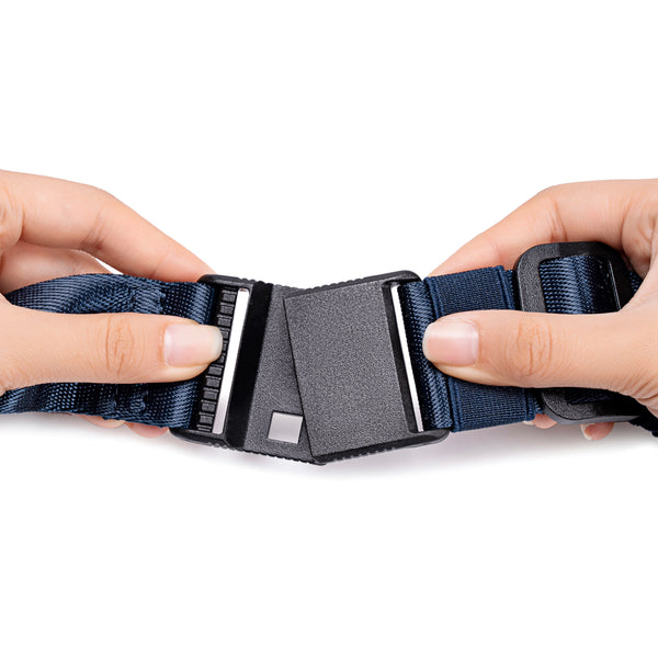 Two hands adjusting a navy blue pet collar