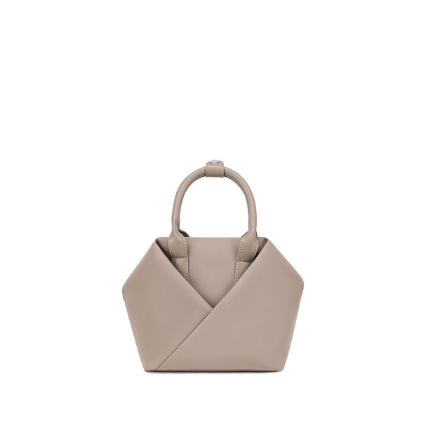 Champagne Taupe handbag with a unique design.