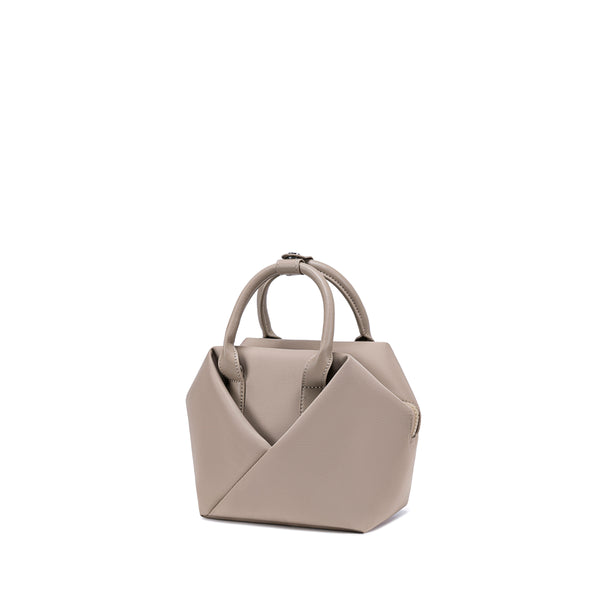 Champagne Taupe handbag with a unique design - Corner view.