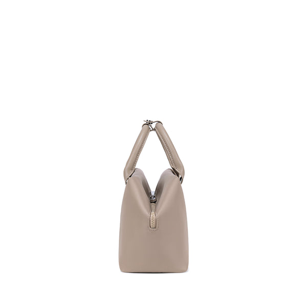 Champagne Taupe handbag with a unique design - Side view.