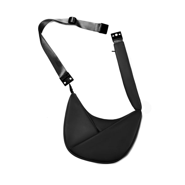 Black sling bag with straps on a white background