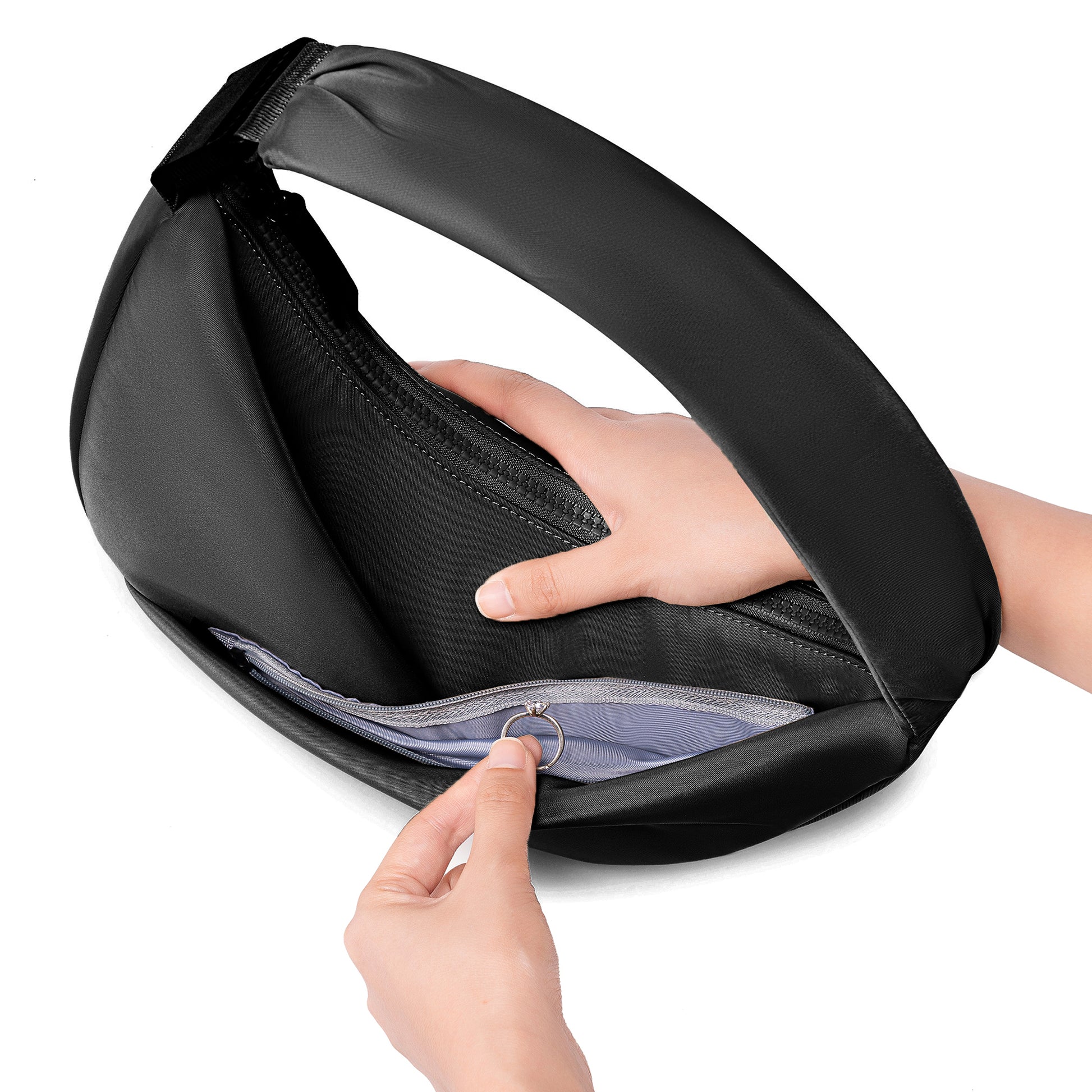 Black travel pouch with a hand opening it on a white background