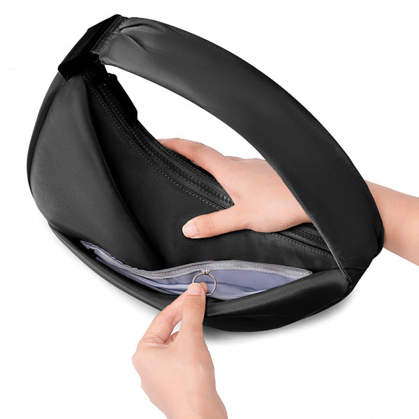 Black travel pouch with a hand opening it on a white background