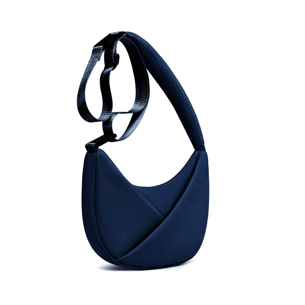Midnight Blue handbag with a strap on a white background