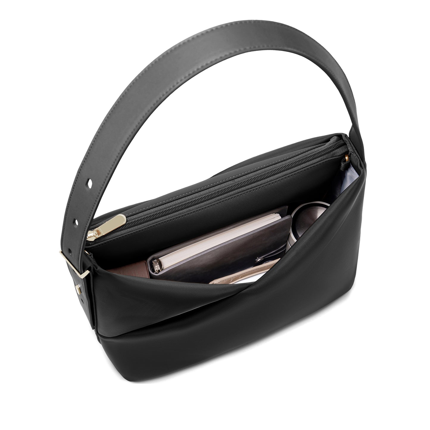 Interior view of the black Origami Hobo Bag organized with a phone and essentials, showing gold-tone base feet.

