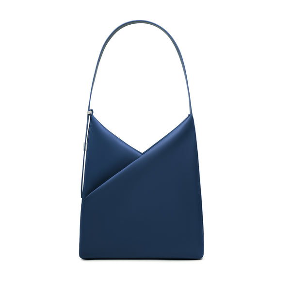 Lux & Nyx Origami Hobo Bag in navy, front view, showing the signature geometric origami fold and single curved shoulder handle.