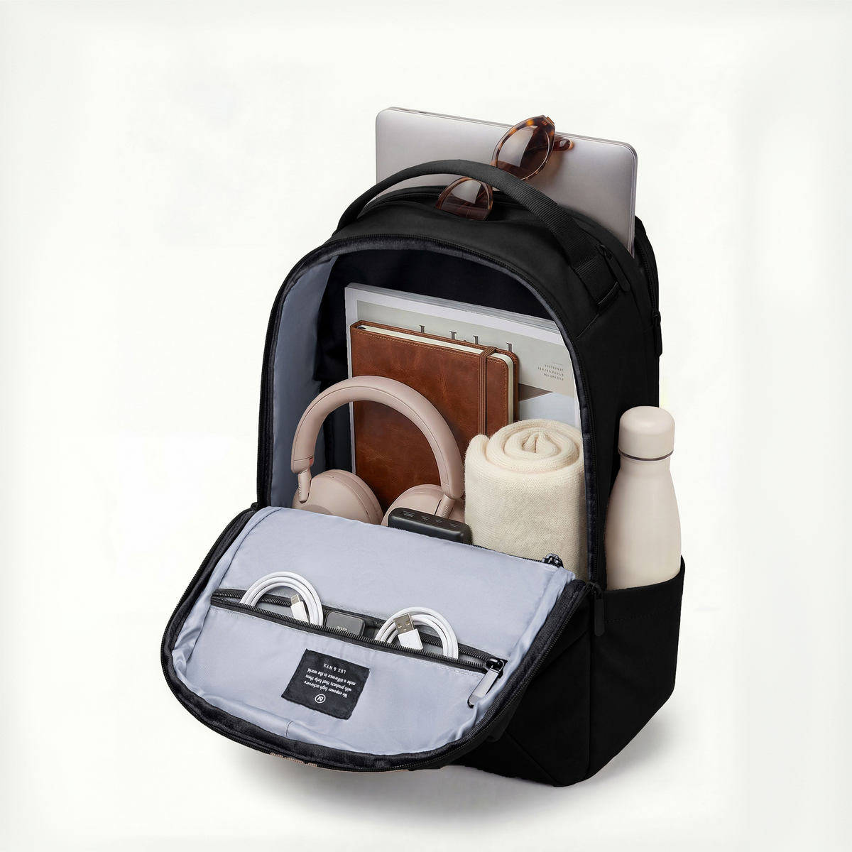 Lux & Nyx Origami Backpack - 16" Laptop Backpack With Trolley Strap - Black - Backpack Quarter View of Internal Compartments With Backpack Contents