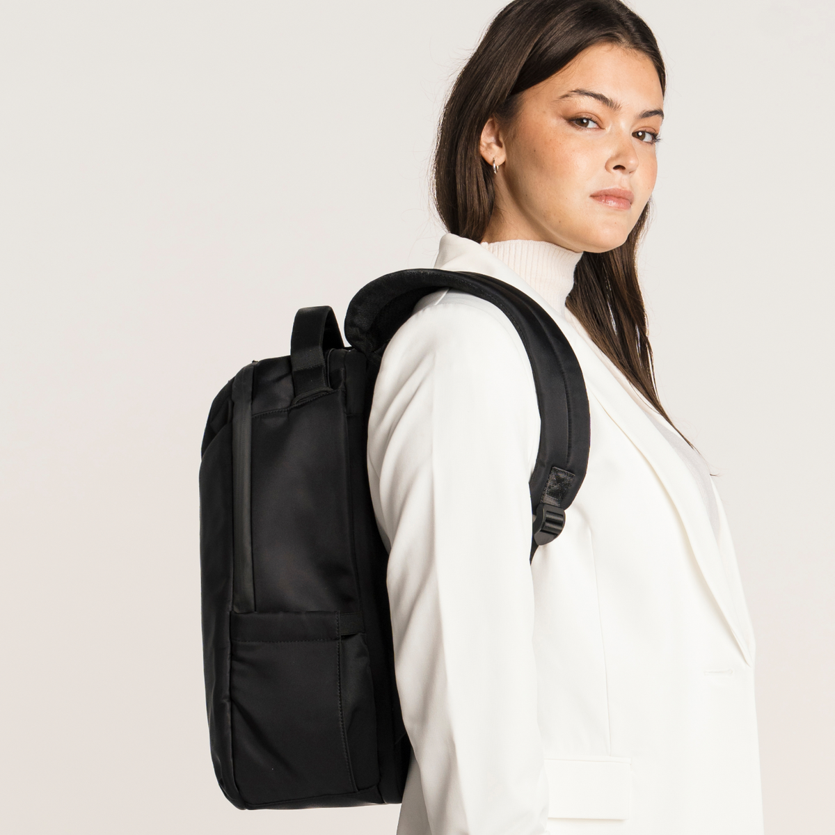 Lux & Nyx Origami Backpack - 16" Laptop Backpack With Trolley Strap - Black - Professional Woman Wearing The Origami Backpack in Black
