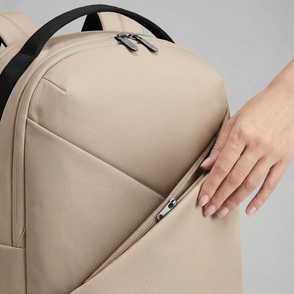 Lux & Nyx Origami Backpack - 16" Laptop Backpack With Trolley Strap - 
Champagne Taupe - Close-up origami front zip pocket.