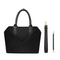 Black laptop bag with dual rounded top handles and a geometric V-shaped front seam, shown with two detachable black straps (a wide adjustable crossbody strap and a short wristlet strap) featuring gold-tone clasps.
