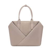 Lux & Nyx champagne taupe handbag with a geometric V-shaped envelope front panel and dual top handles.