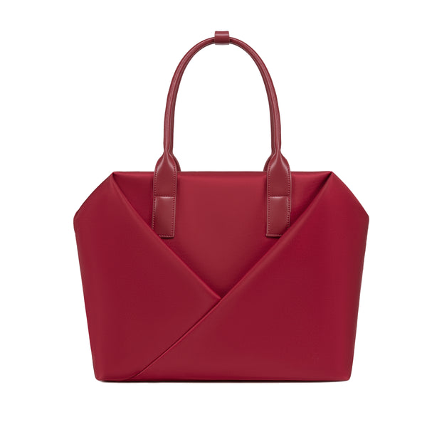Lux & Nyx crimson red handbag with a geometric V-shaped envelope front panel and dual top handles.