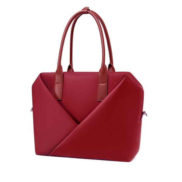 Angled view of a top-handle crimson red satchel silhouette with front V-seam detail.