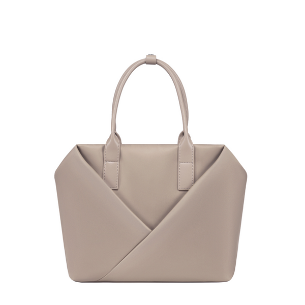 Lux & Nyx Champagne handbag with a geometric V-shaped envelope front panel and dual top handles.
