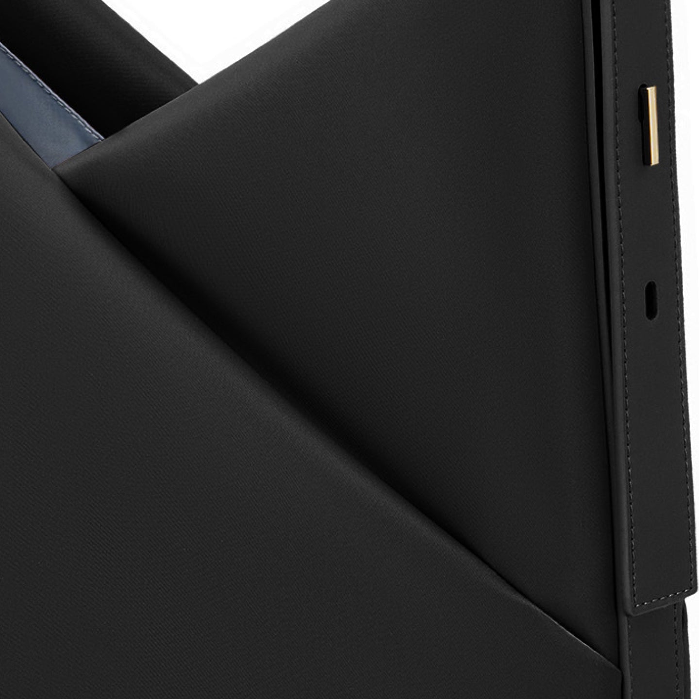 Close-up of the black hobo bag highlighting the V-shaped front design and adjustable strap with gold-tone hardware.
