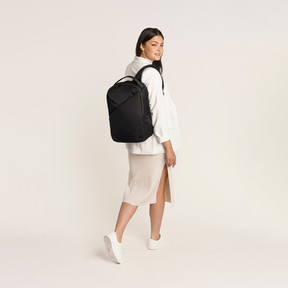 Lux & Nyx Origami Backpack - 16" Laptop Backpack With Trolley Strap - Black - Professional Woman Wearing The Origami Backpack in Black