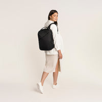 Lux & Nyx Origami Backpack - 16" Laptop Backpack With Trolley Strap - Black - Professional Woman Wearing The Origami Backpack in Black