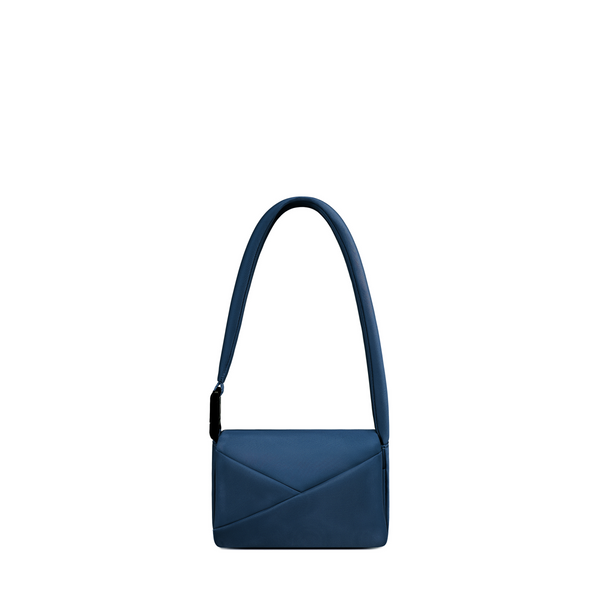 Lux & Nyx Origami Flap Bag in Navy, crossbody bag presented in its alternate wear as a mini shoulder bag.