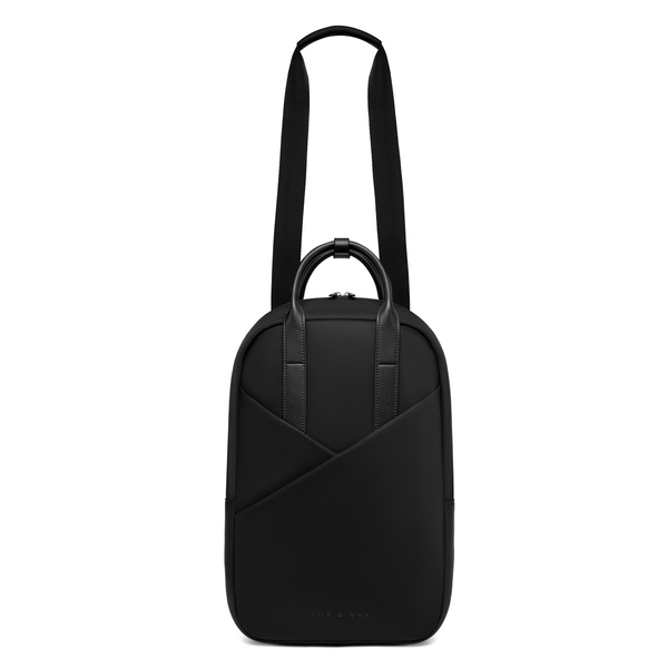 Origami Slim Black  Backpack worn crossbody style, showing adjustable strap