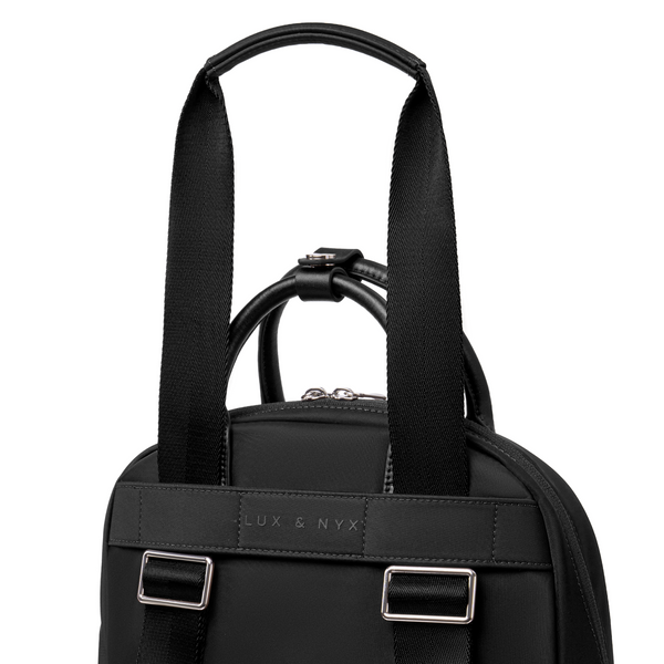 Origami Slim Black  Backpack rear view showing back panel, straps, and top handle hardware detail