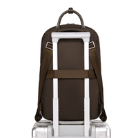 Origami Slim Backpack secured on rolling luggage handle, showing luggage sleeve passthrough