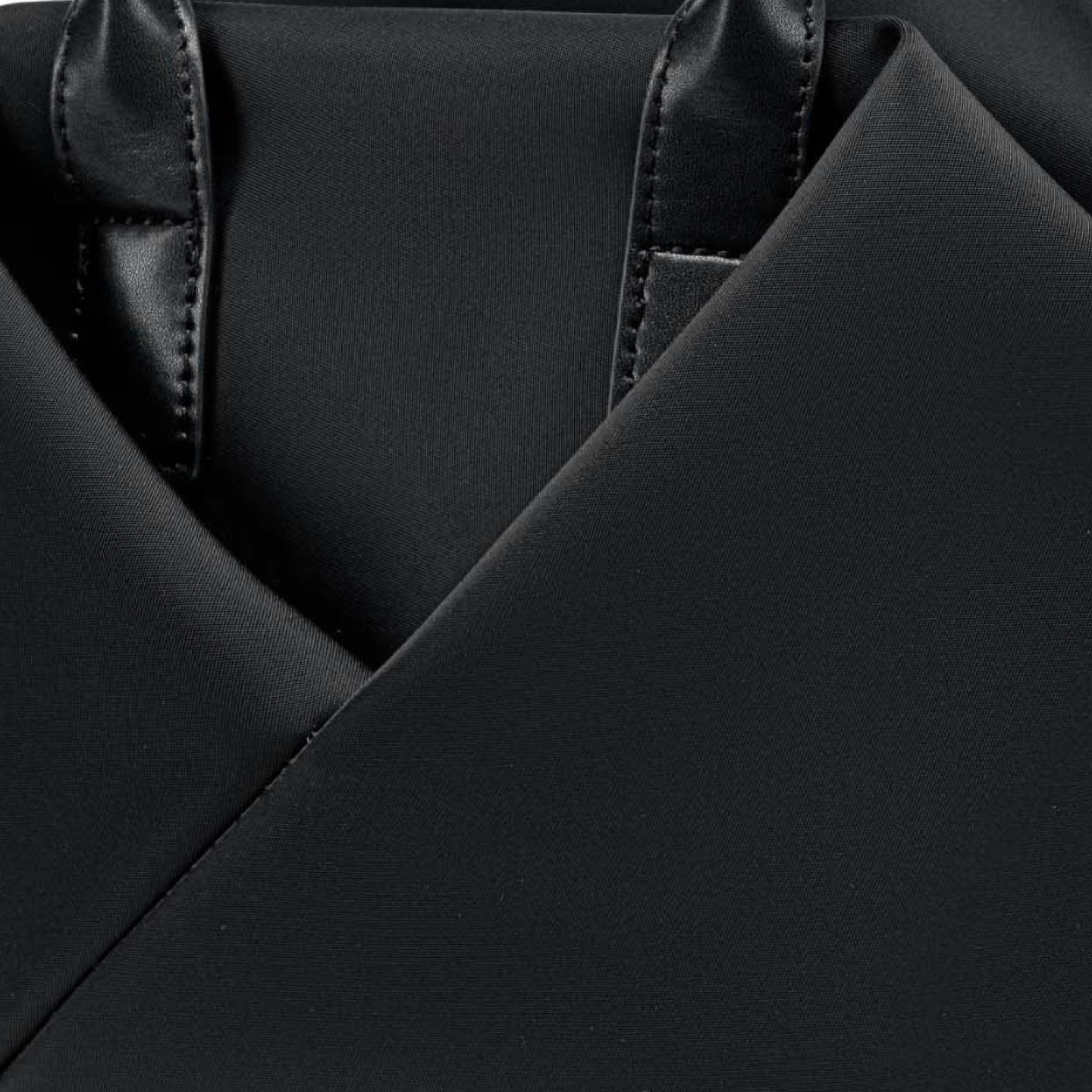 Close-up of a black garment with a V-neckline and satin trim.