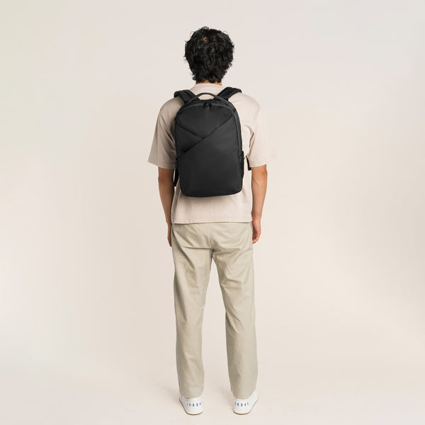 Lux & Nyx Origami Backpack - 16" Laptop Backpack With Trolley Strap - Black - Professional Man Wearing The Origami Backpack in Black