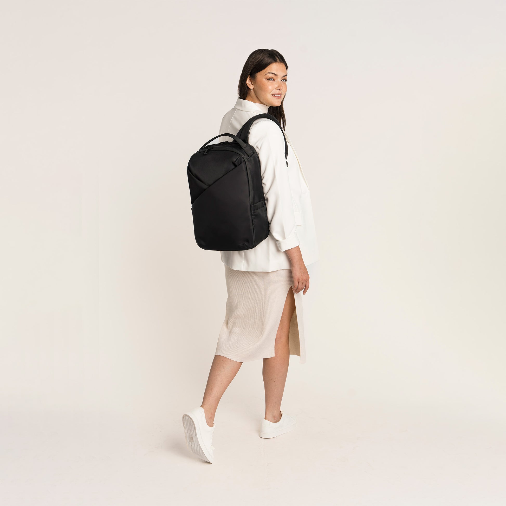 Lux & Nyx Origami Backpack - 16" Laptop Backpack With Trolley Strap - Black - Professional Woman Wearing The Origami Backpack in Black