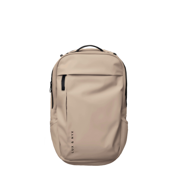 Beige Lux & Nyx Purpose Backpack, front view, with top grab handle, vertical front zip pocket, and side slip pockets