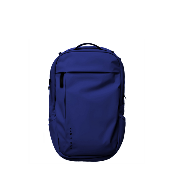 Navy Lux & Nyx Purpose Backpack, front view, with top grab handle, vertical front zip pocket, and side slip pockets