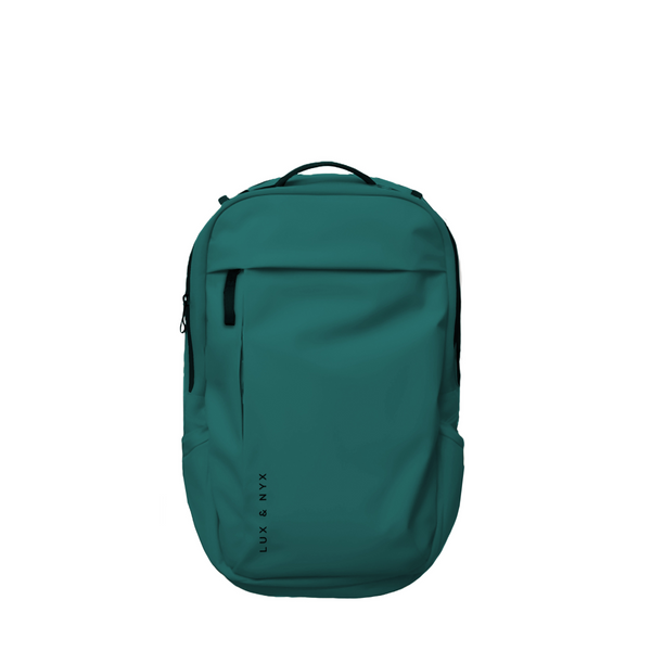 Teal Lux & Nyx Purpose Backpack, front view, with top grab handle, vertical front zip pocket, and side slip pockets