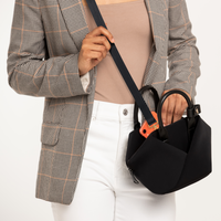 Lux & Nyx Small Origami Crossbody & Handbag Tote Ultra Matte - Black - Woman Wearing The Tote in Crossbody Mode, Putting Her Phone Inside The Tote