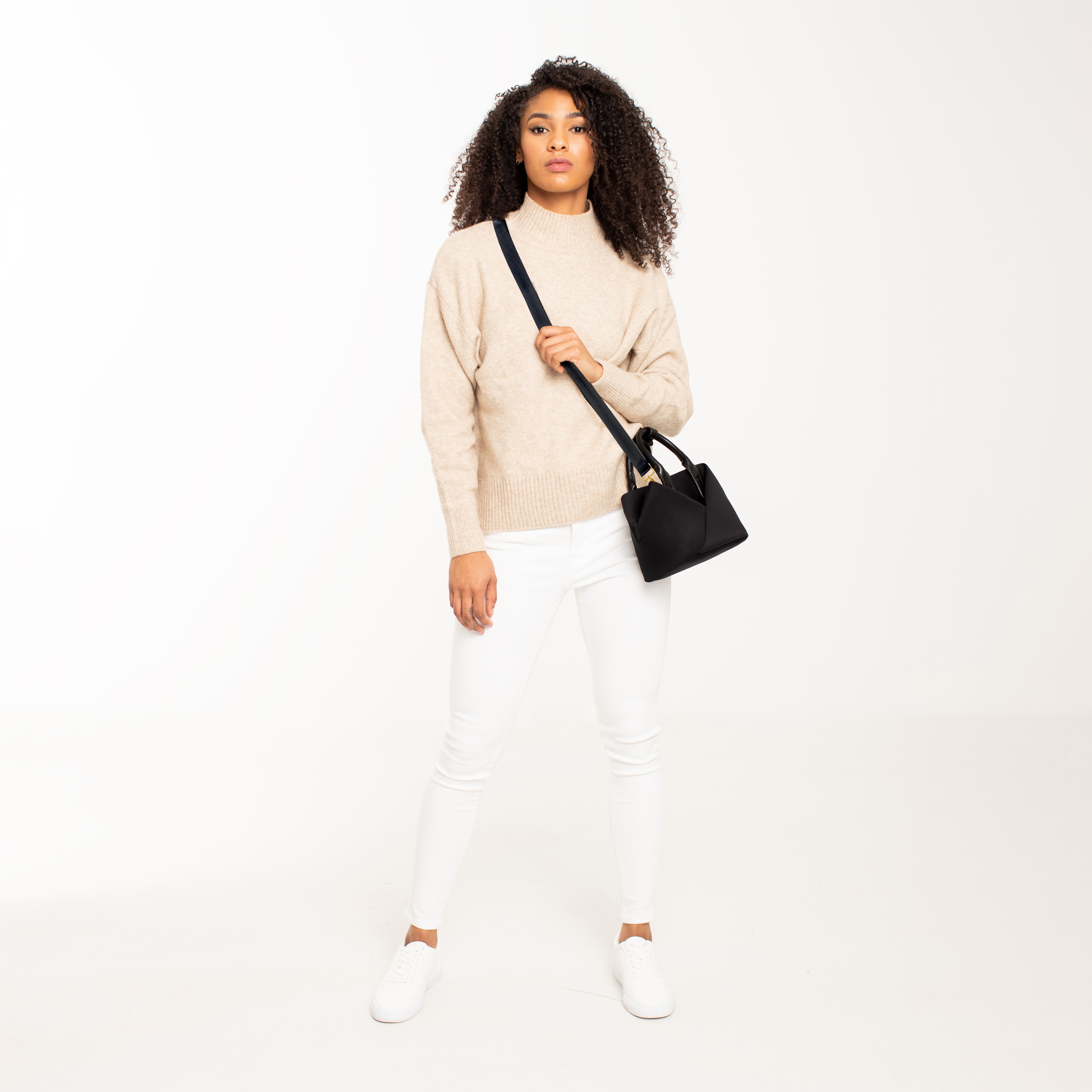 Lux & Nyx Small Origami Crossbody & Handbag Tote Ultra Matte  - Black - Woman Wearing The Tote in Crossbody Mode