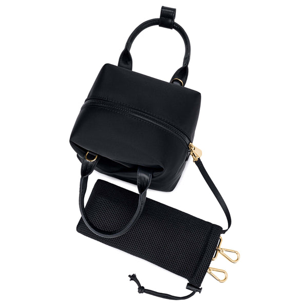 black-with-gold-hardware origami-style leather handbag &  displayed bottom a small black mesh drawstring pouch.
