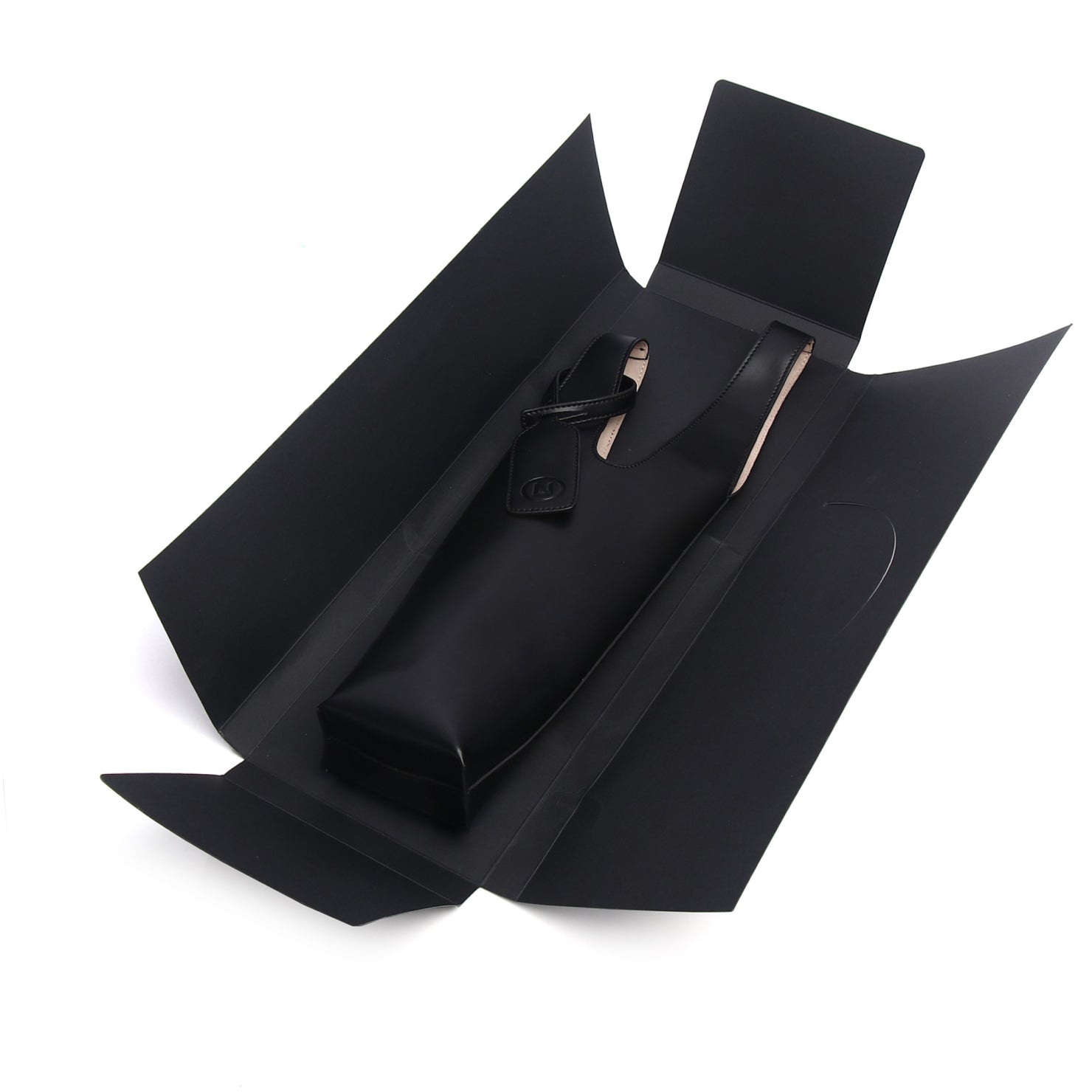 Black open box with a pen inside on a white background