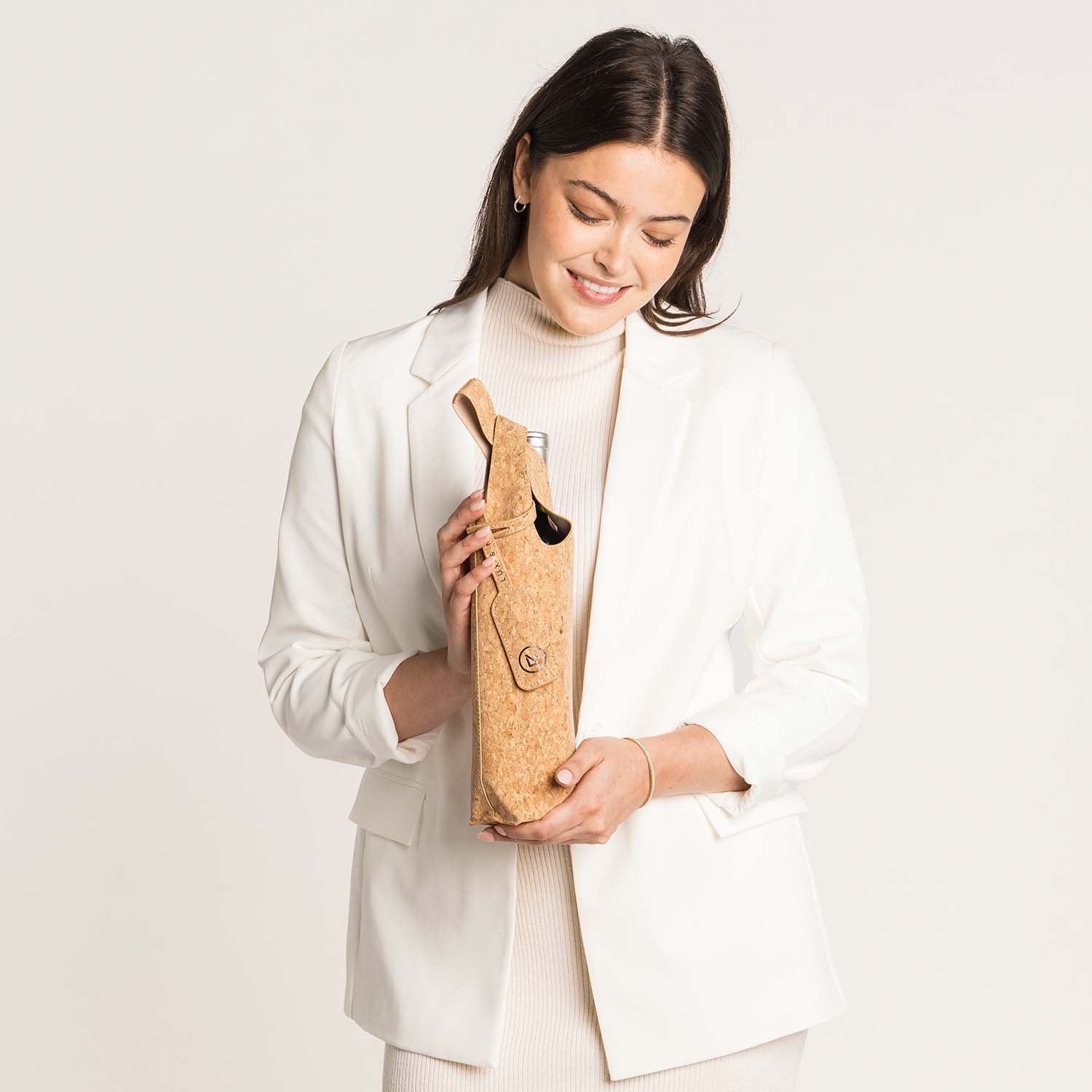 Lux & Nyx Wine Tote - Cork - Woman Holding The Wine Tote With A Wine Bottle Inside