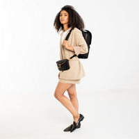 Lux & Nyx Little Zoe Backpack - 13" Laptop Backpack With Detachable 5-Way Wear Crossbody Clutch - Black - A Professional Woman Wearing The Backpack and The Detachable 5-Way Wear Crossbody Clutch in Belt Bag Mode